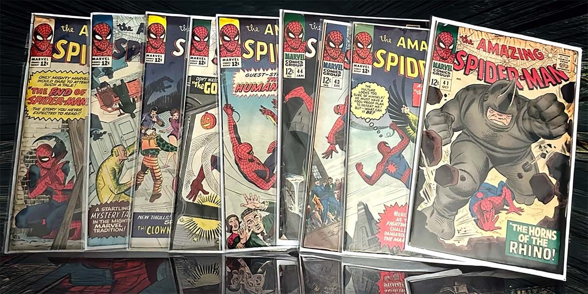 Collection of vintage The Amazing Spider-Man comic books in protective sleeves, featuring key issues like number 41 and 50